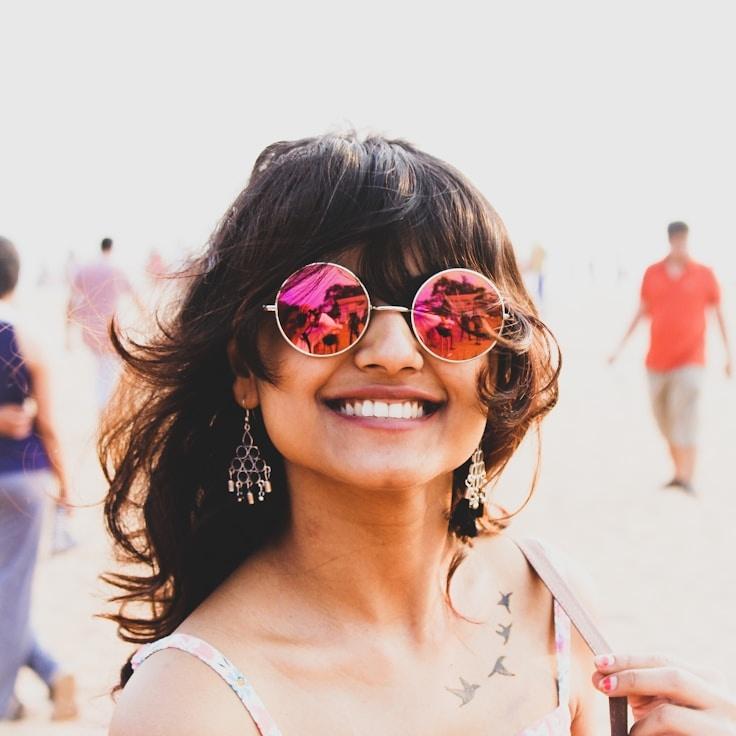 Kaveri Mehta, Lead Design Curator at LedgerWoodMeadowDusk, reviewing corporate floral arrangements